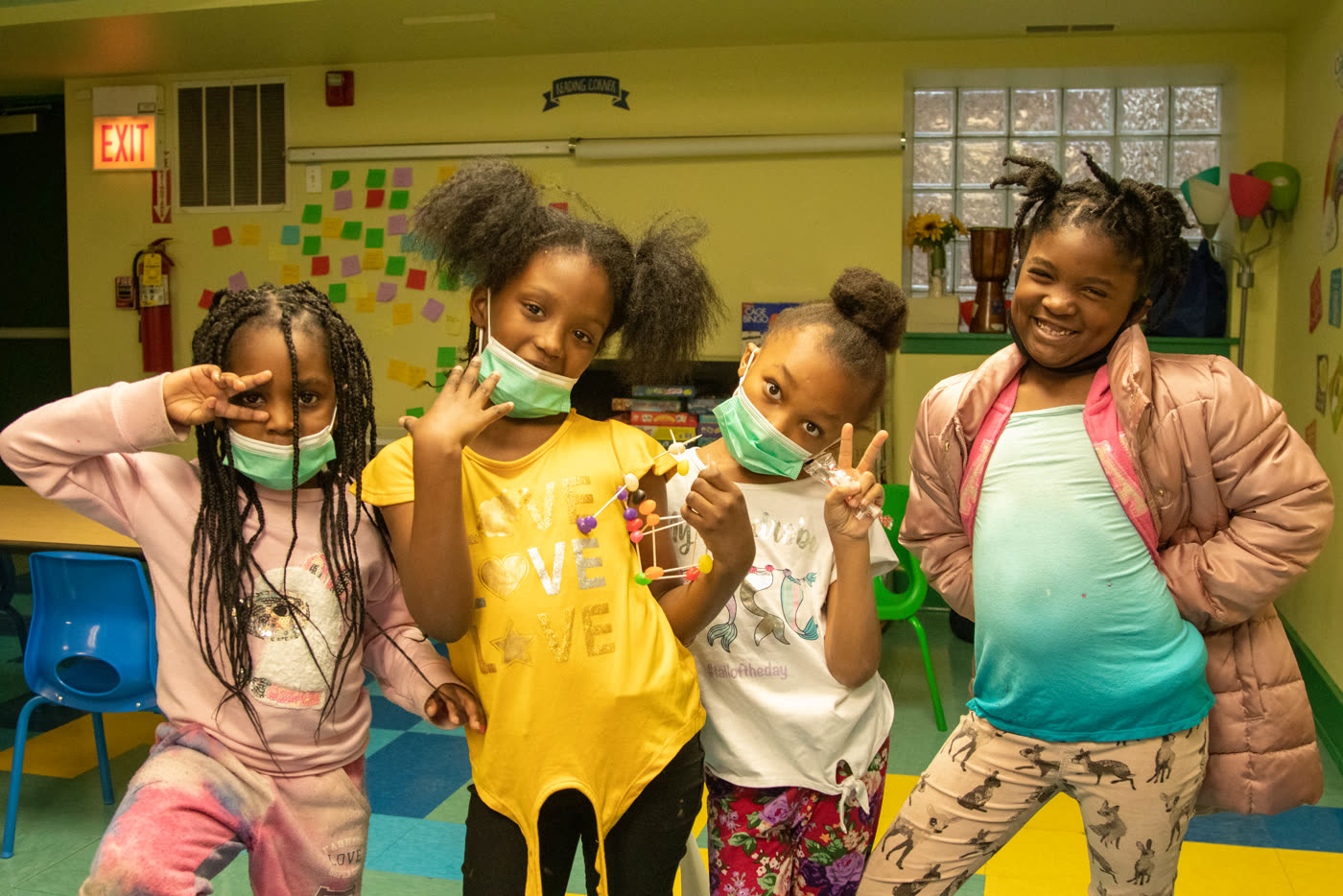 Four students posing together after a session